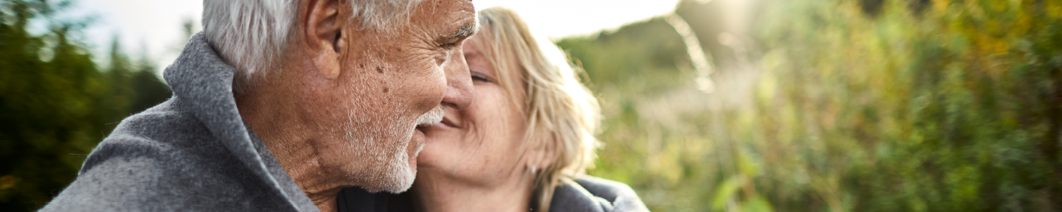 Older couple embracing each other.